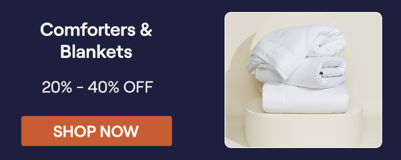 Stack of Slumber Cloud Comforters on a pillar