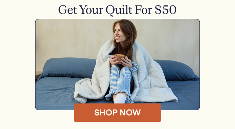 Woman wrapped up in a Cotton Quilt