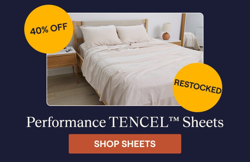 The Sand Performance TENCEL™ Sheet Set on a bed