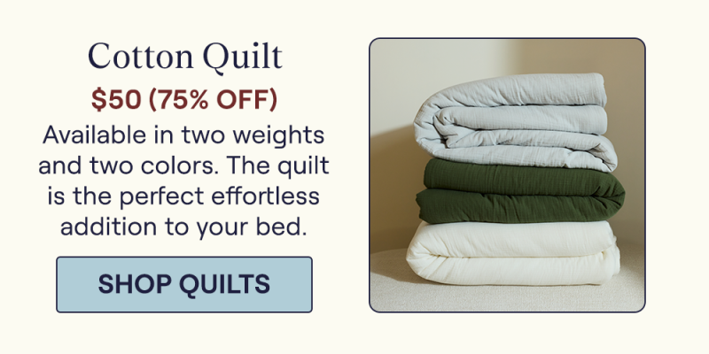 Stack of the Mist, Moss, and Pearl Cotton Quilts folded on a stool