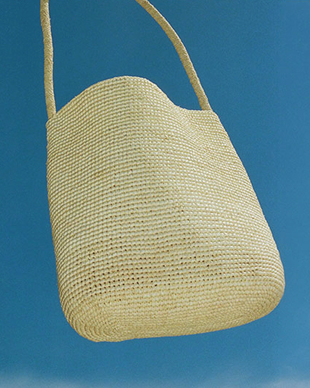 Our summer bag edit is defined by material and craft. Natural woven raffia totes designed to breathe. Soft gathered leather silhouettes that move with wear. Hand-crocheted pieces in partnership with female artisans. Each piece is shaped for summer and designed to last beyond the season.