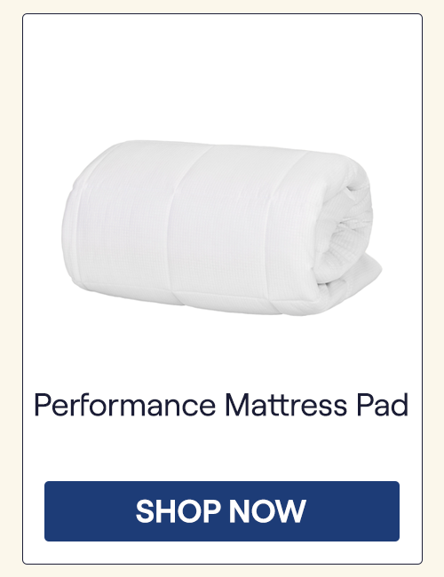 A folded Performance Mattress Pad on a white background