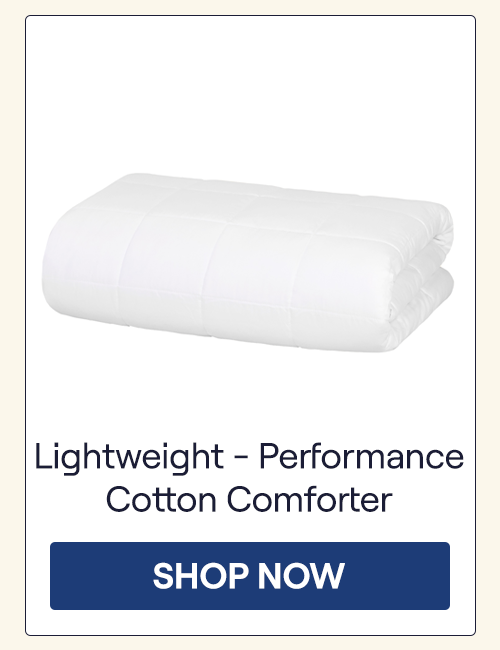 A folded Lightweight Performance Cotton Comforter on a white background
