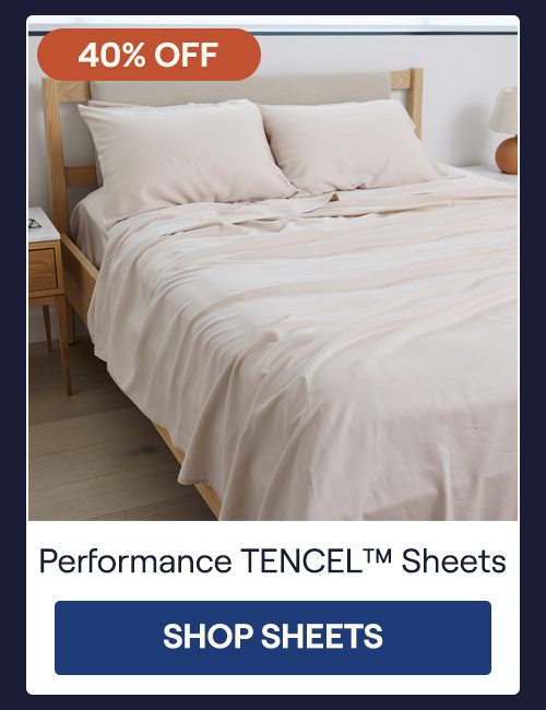 The Sand Performance TENCEL Sheet Set on a bed