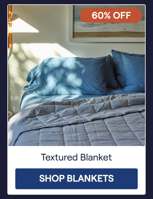The Pewter Textured Blanket on a bed 