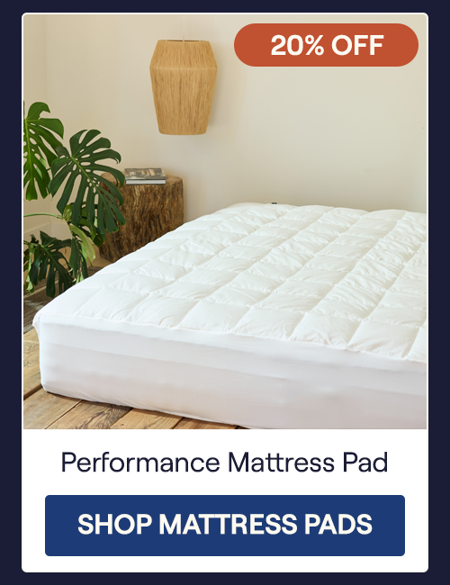 A mattress with the Performance Mattress Pad laying on it
