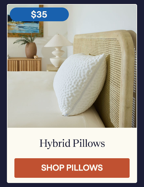 A Hybrid Pillow laying on a bed with the zipper showing to highlight the removable insert feature