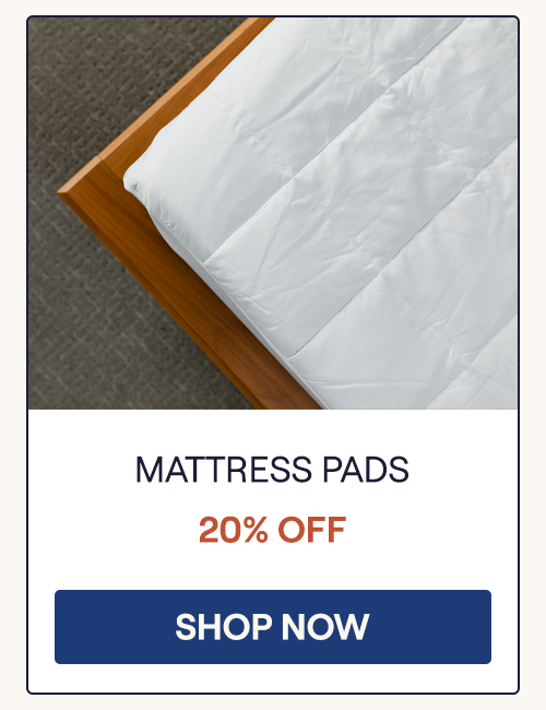 Overhead view of the corner of a Core Mattress Pad on a bed