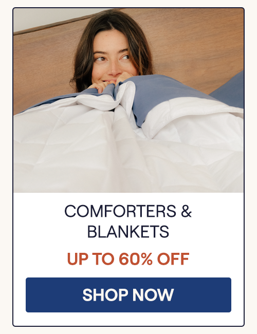 A woman hugging a top sheet and a lightweight Performance Cotton Comforter