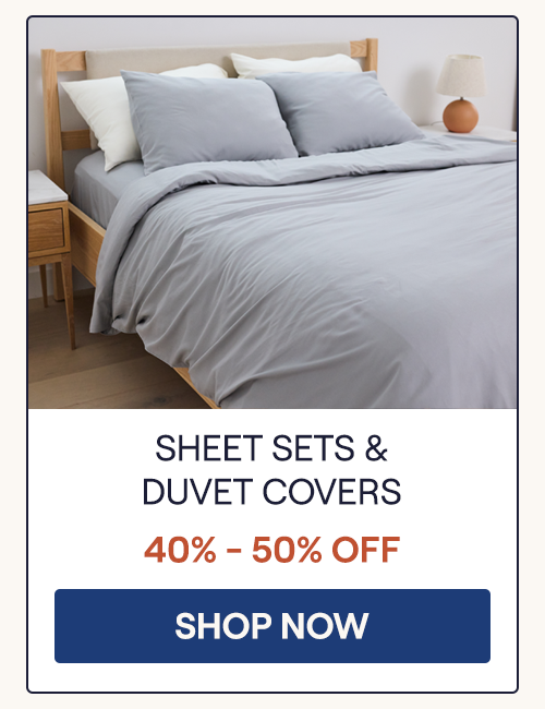 A bed with the Storm Performance Linen Blend Sheet Set and Duvet Cover