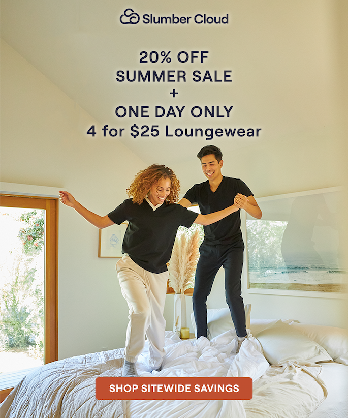 A couple jumping on a bed with Slumber Cloud bedding while wearing Slumber Cloud loungewear