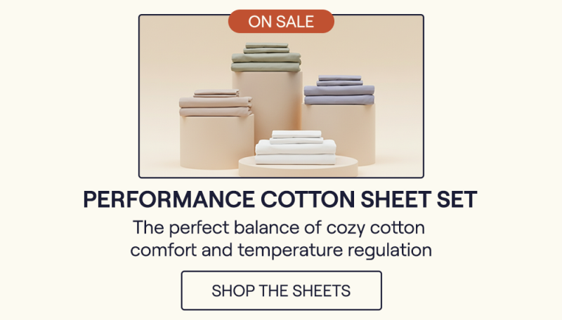 The Performance Cotton Sheets in Sage, Pewter, White, and Sand sitting on pillars.