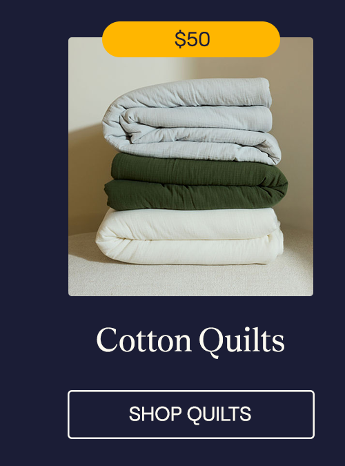 A stack of Mist, Moss, and Pearl Cotton Quilts