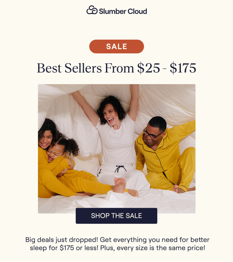 A family laying in bed under the Slumber Cloud Performance Cotton Comforter