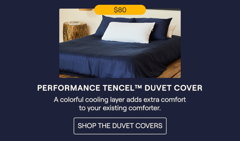 The Navy Performance TENCEL™ Duvet Cover on a bed
