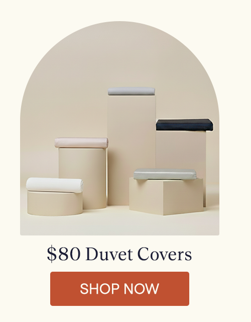 The Performance TENCEL™ Duvet Covers sitting on pillars.