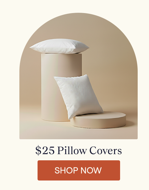 Two pillows with Performance Pillow Covers on them while resting on pillars