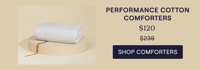 The Lightweight Performance Cotton Comforter sitting on a pillar