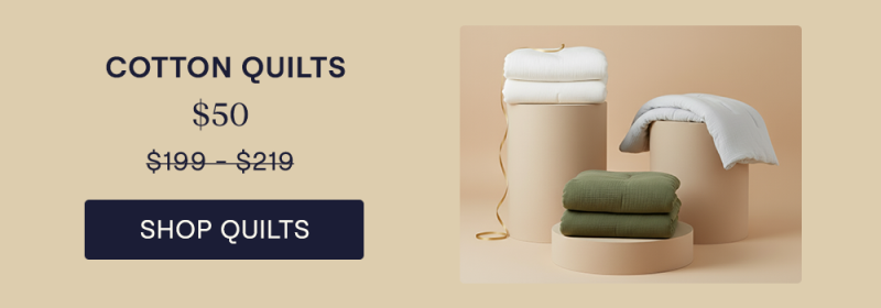 The Moss, Mist, and Pearl Cotton Quilts sitting on pillars
