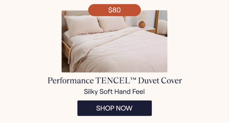 Sand Performance TENCEL Sheets and a Duvet Cover on a bed