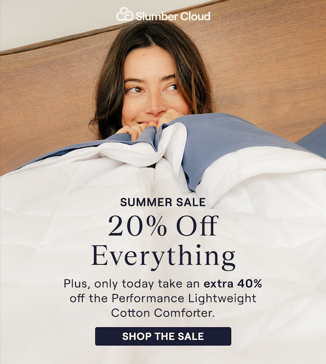 Woman hugging the Lightweight Performance Cotton Comforter
