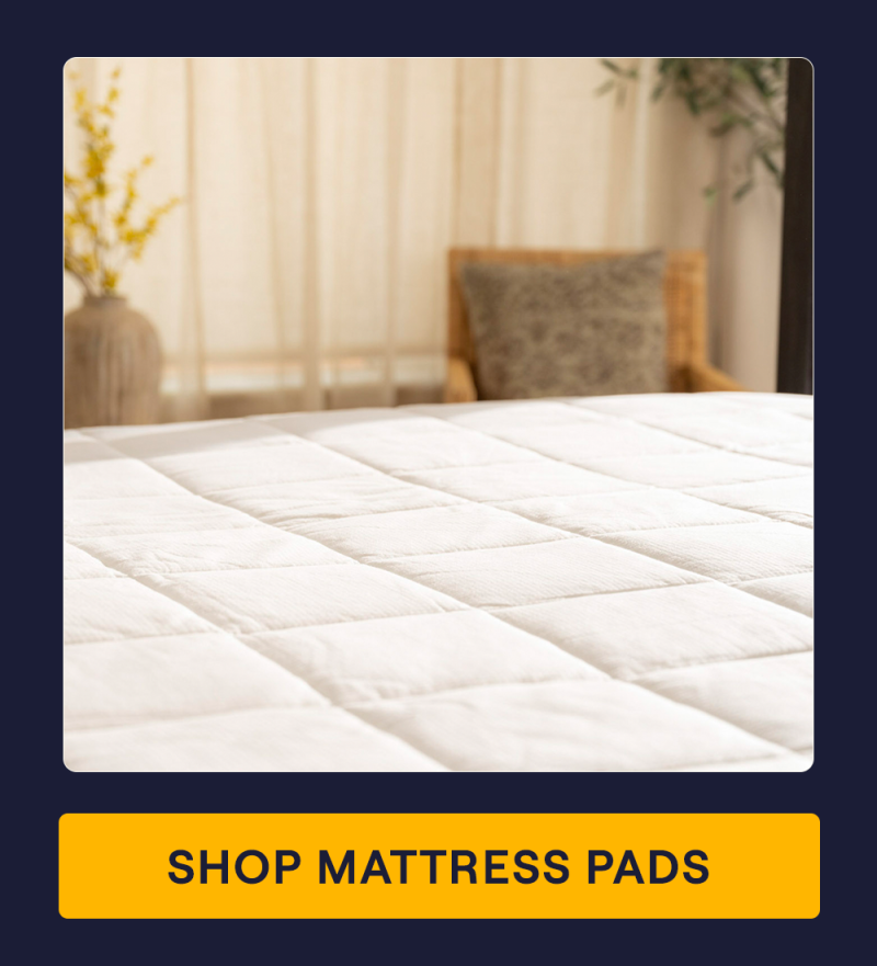A bed with the Performance Mattress Pad 