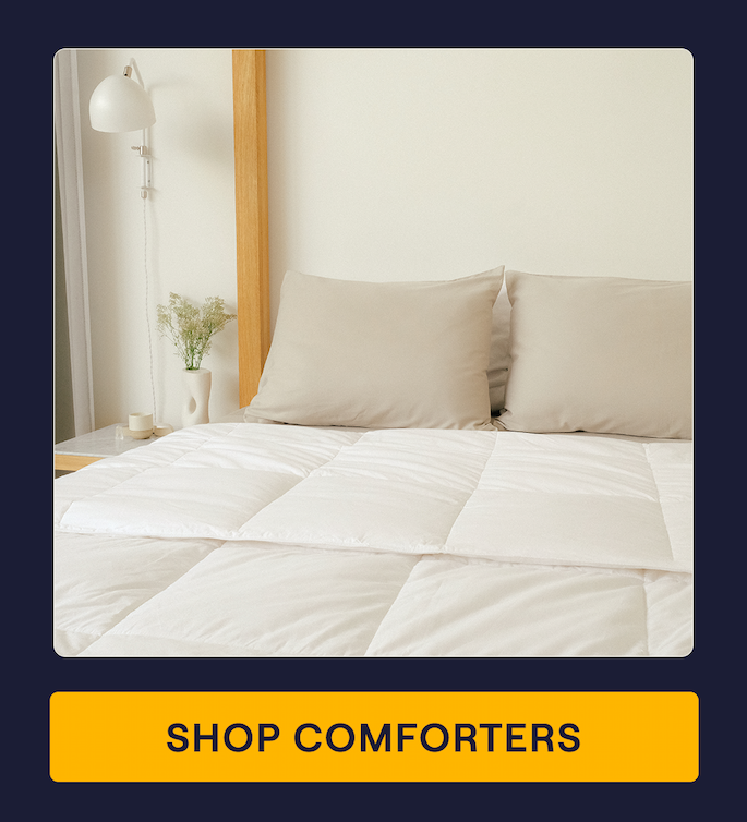A bed with the all-season Cotton Comforter on it
