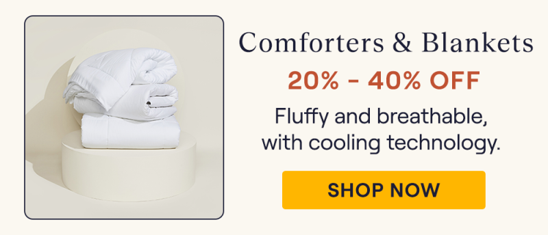 Comforters stacked on a pillar