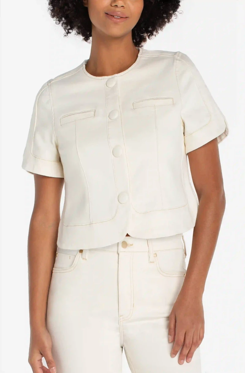 Image of COLLARLESS SHORT SLEEVE CROPPED JACKET
