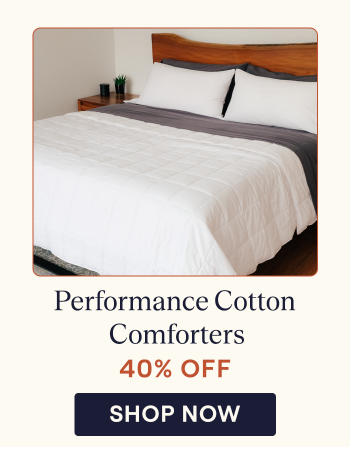 A bed made with the Performance Cotton Comforter in the lightweight version