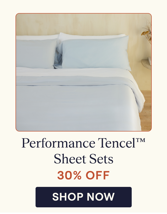 A bed made with a Alice Blue Performance TENCEL Duvet Cover and White Performance TENCEL Sheets