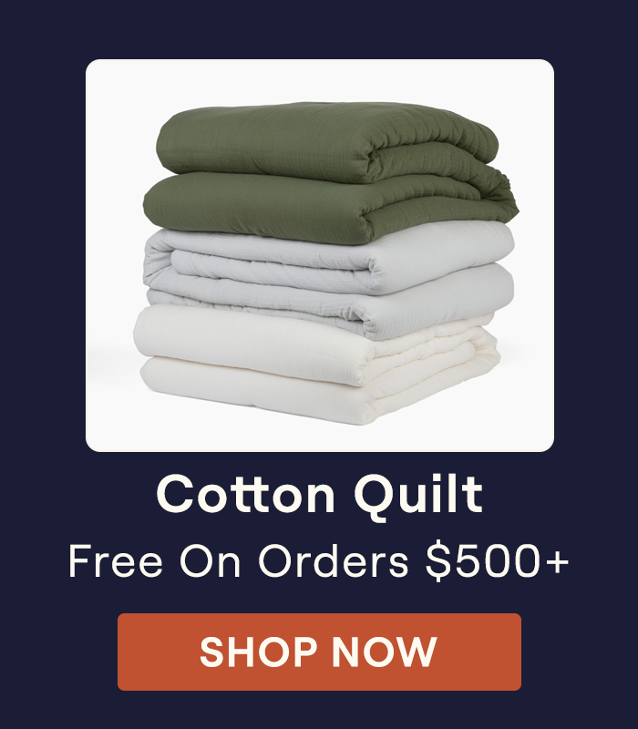 Stack of Cotton Quilts on a white background